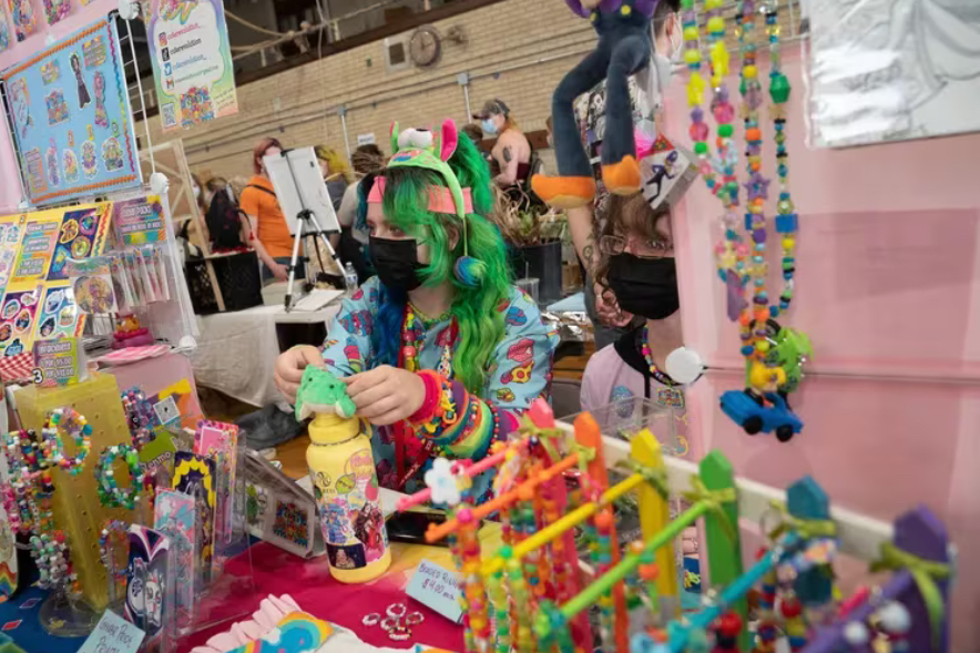 attendees at the december 10 trans art mart browsed colorful works by local artists, who tabled in the bok building gym